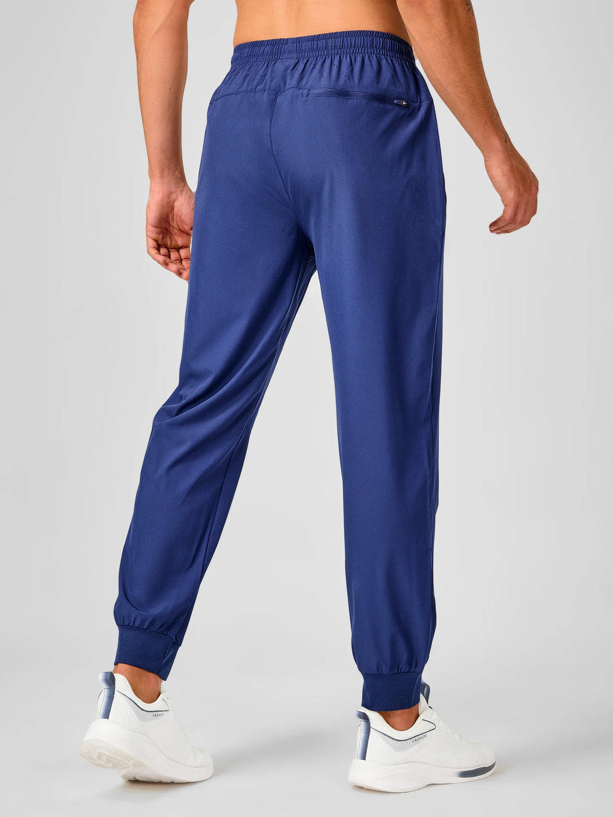 
Men's Tapered Running Workout Joggers with 3 Zipper Pockets — NORTHYARD men's dark blue tapered workout joggers, back view on model — dark blue