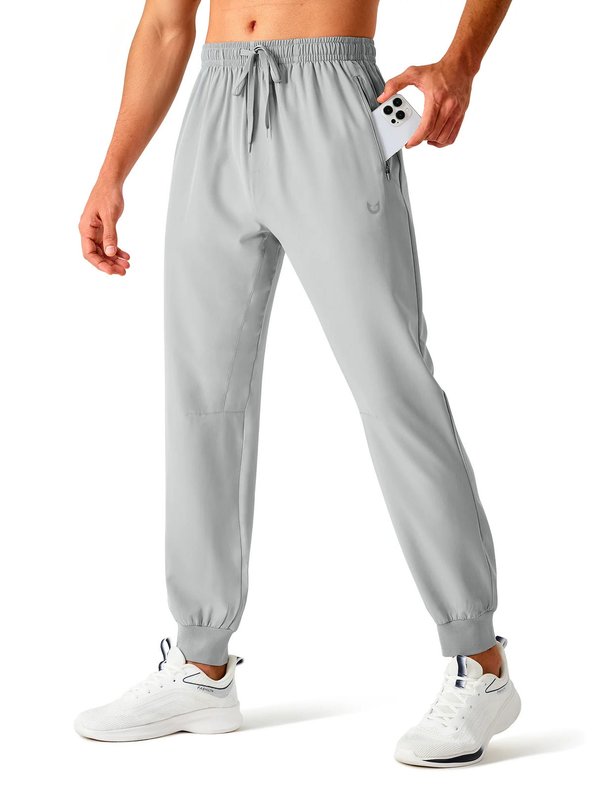 
Men's Tapered Running Workout Joggers with 3 Zipper Pockets — NORTHYARD men's light grey tapered workout joggers, front view on model — light grey