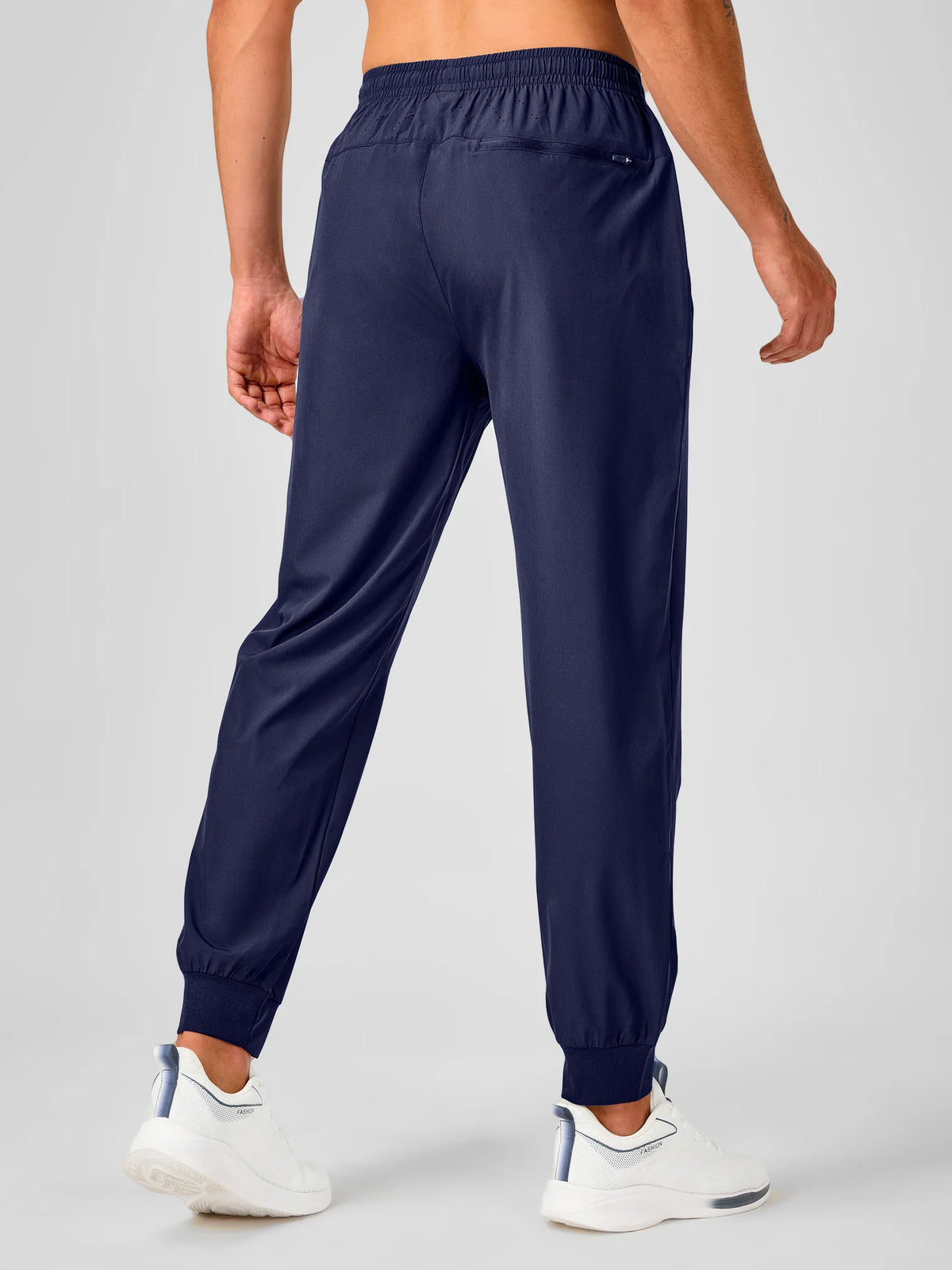 
Men's Tapered Running Workout Joggers with 3 Zipper Pockets — NORTHYARD men's navy tapered workout joggers, back view on model — navy
